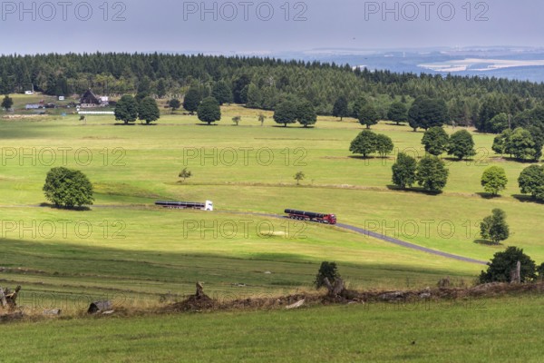 Truck transporting large steel oil and gas pipes, excessive load and heavy delivery concept Prague Czech republic