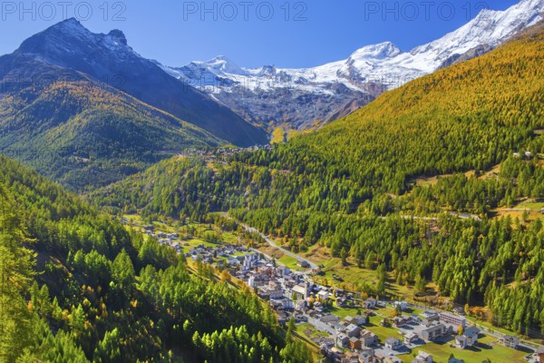 View of Saas-Grund and Saas-Fee with Alalin 4027m and Alphubel 4206m in autumn, Saas-Fee, Saasertal, Valais, Switzerland