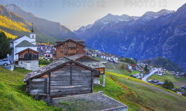 City overview on a mountain terrace above the valley with Ulrichshorn 3925 m after sunset, Grächen, Mattertal, Valais, Switzerland
