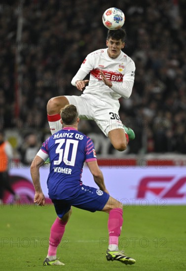 Header duel action Jose Maria Chema Andres Baixauli VfB Stuttgart (30) versus Silvan Widmer 1. FSV Mainz 05 (30) MHPArena, MHP Arena Stuttgart, Baden-Württemberg, Germany