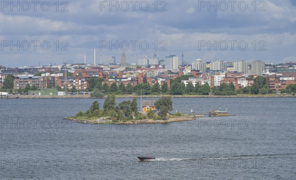 Small island Katajanokanluoto with a wooden house, skyline, harbor, Helsinki, Finland