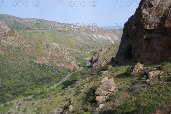 Mountain landscape with road, green hills and rocky gorges, view from Noravank monastery, Noravank, Vayots Dzor province, Vayots Dzor, Armenia, Caucasus