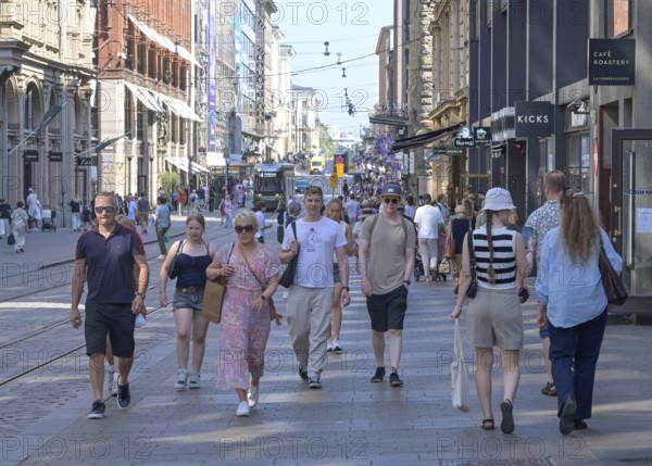 Passers-by, Aleksanterinkatu shopping street, Old Town, Helsinki, Finland