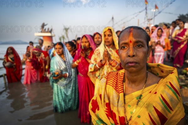 Hindu devotees offer prayers to the Sun God on the bank of Brahmaputra river on the occasion of Chhath Puja, in Guwahati, India on 27 October 2025