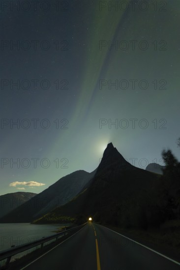 National mountain of Norway - Stetind in the Nordland under auroras and a full moon