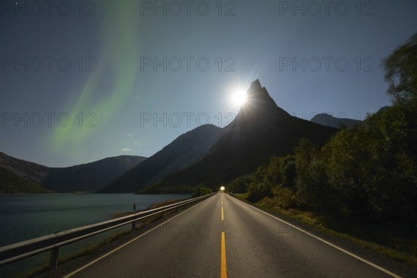 National mountain of Norway - Stetind in the Nordland under auroras and a full moon