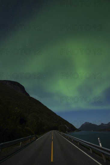 Tysfjord near Stetind Mountain in northern Norway under auroras and full moon