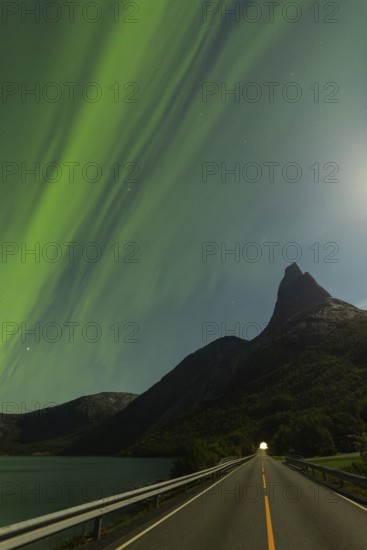 Magical Stetind, mountain in northern Norway under auroras and full moon