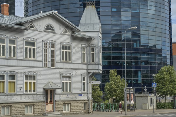 Modern office building, high-rise building, small old building, wooden house, Maakri-Kvartal business district, Liivalaia, Tallinn, Estonia