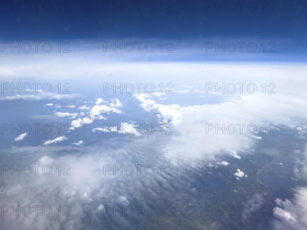 View from airplane of white bright cluster clouds Cirrus cirrus clouds, international