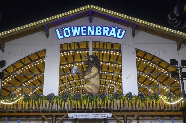 Löwenbräu festival tent at Oktoberfest, night view, Munich, Bavaria, Germany