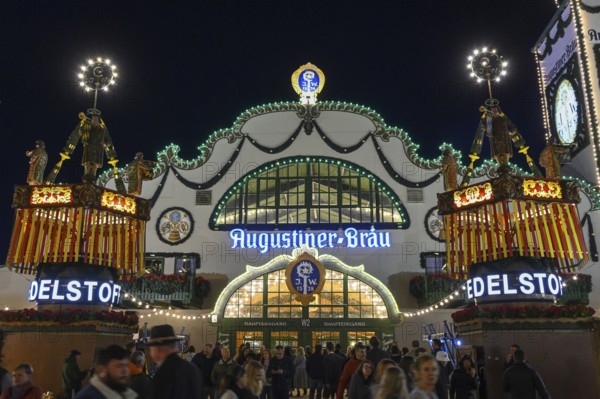 Wies'n visitors in front of the Augustiner festival tent, night view, Oktoberfest, Munich, Bavaria, Germany