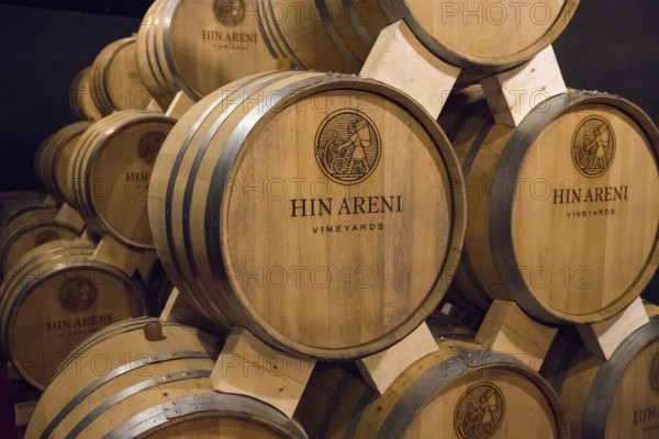 Close-up of Hin Areni brand wooden barrels in a wine cellar, Hin Areni winery, Areni village, Vayots Dzor province, Wajoz Dzor, Armenia, Caucasus