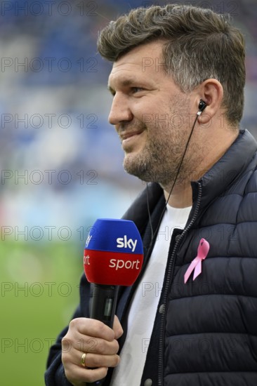 Managing Director Sports Andreas Schicker TSG 1899 Hoffenheim Portrait in interview microphone micro logo SKY loop of action against breast cancer, breast cancer awareness campaign, smiles, PreZero Arena, Sinsheim, Baden-Württemberg, Germany