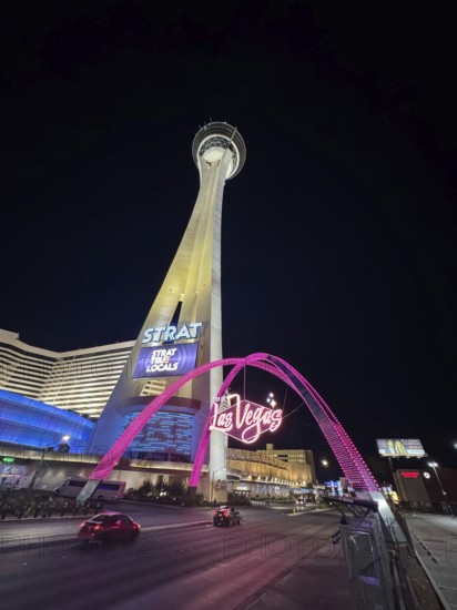 Since the legalization of gambling in the 1930s, Las Vegas has developed as a tourist center of international importance. Where simple casinos initially settled, Las Vegas is now characterized by luxurious hotel complexes with large casinos and leisure facilities, Las Vegas at night with illuminated tower and street scene, Las Vegas, Nevada, USA