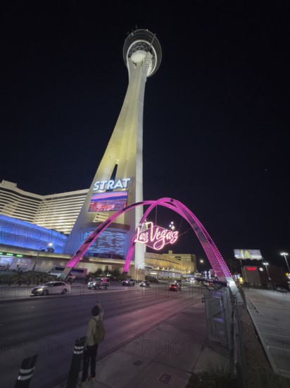Since the legalization of gambling in the 1930s, Las Vegas has developed as a tourist center of international importance. Where simple casinos initially settled, Las Vegas is now characterized by luxurious hotel complexes with large casinos and leisure facilities, evening shot of a tower in Las Vegas with colorful neon lights, Las Vegas, Nevada, USA