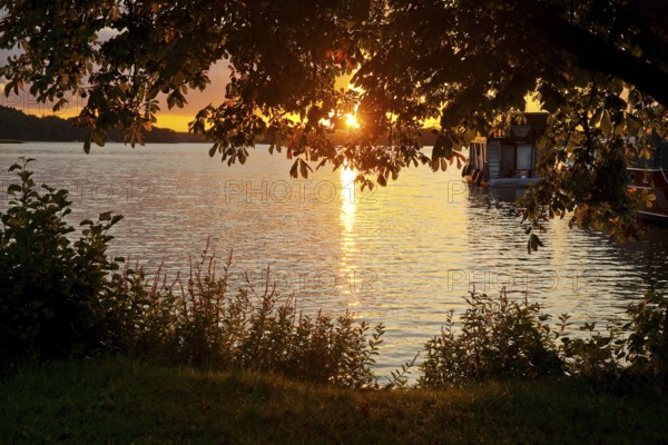 Atmospheric sunset over Lake Gudelack, Lindow (Mark), Stechlin-Ruppiner Land nature park Park, Brandenburg, Germany