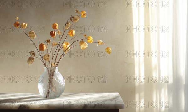 A vase of dried flowers sits on a table in a room with a window. The flowers are yellow and brown, and the vase is clear. The room is bright and sunny. AI generated