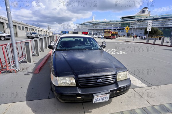 Police vehicle in front of a cruise ship near Fisherman's Wharf in San Francisco
