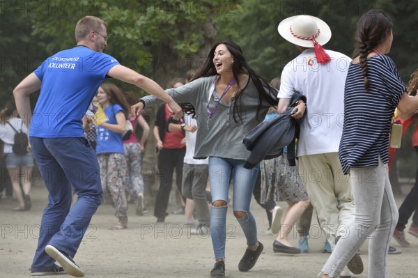 WROCLAW, POLAND - JULY 24, 2016: Dancing pilgrims of the World Youth Day during open concert Mercy Fest. The concert is part of the Days in the Dioceses of World Youth Day