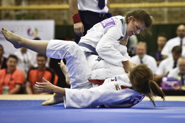 WROCLAW, POLAND - JULY 29, 2017: Ju-Jitsu Ne-Waza during the The World Games 2017. Fight for thirth place between Chloe Claude Laurence Lalande FRANCE (red) vs Emilia Mackowiak POLAND (blue)