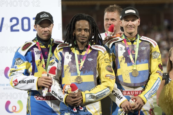 WROCLAW, POLAND - JULY 29, 2017: Speedway couple turnament during The World Games 2017. Decoration team of Sweden bronze medalist, from left Peter Ljung, Antonio Lindbaeck, manager, Peter Ljung