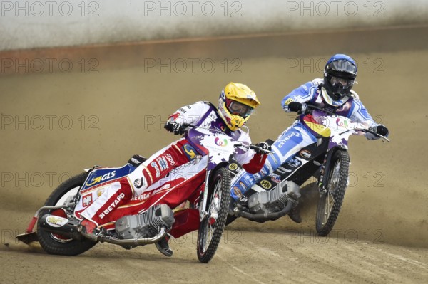 WROCLAW, POLAND - JULY 29, 2017: Speedway couple turnament race Germany - Poland during The World Games. In action Maciej Janowski (Y) and Erik Riss (B)