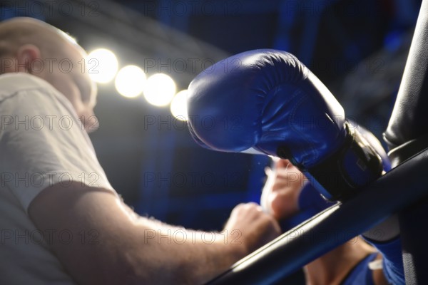 WROCLAW, POLAND - JULY 29, 2017: Muaythai fight during the The World Games 2017. Hand of Aleksandr Abramov (RUS) on the ring rope after the fight with Wiwat Khamtha (THA)