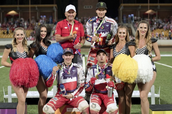 WROCLAW, POLAND - JULY 29, 2017: Speedway couple turnament race Poland - Australia during The World Games 2017. Decoration of gold medalist, from left Marek Cieslak (manager), Patryk Dudek (20), Maciej Janowski (12) and Bartosz Zmarzlik (11)