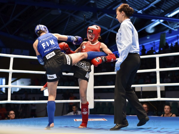 WROCLAW, POLAND - JULY 29, 2017: Muaythai fight during the The World Games 2017. Women fight up to 60 kg Svetlana Vinnikova RUS (red) vs Gia Winberg FIN (blue)