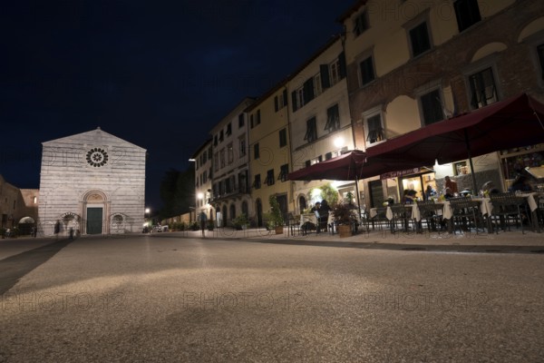 LUCCA, ITALY - JUNE 14, 2015: Old streets with restaurant in the evening in Lucca, Italy. Medieval atmosphere