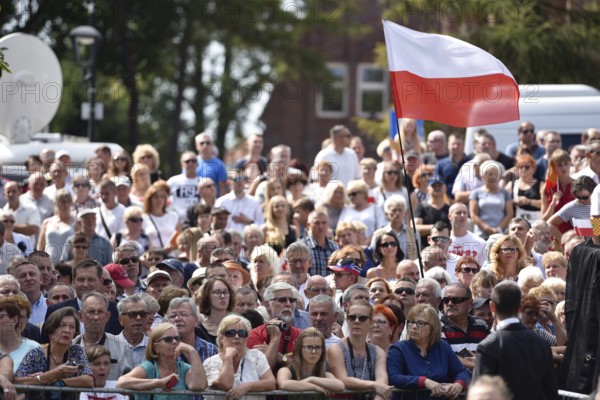 LUBIN, POLAND - AUGUST 31, 2017: Celebrations of the 35th anniversary of the Lubin Crime and the 37th anniversary of the founding Solidarnosc. Audience and polish national flag
