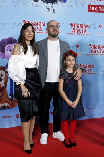 Director Damjan Mitrevski with woman and daughter at a special screening of MISSION SANTA - AN ELF SAVES CHRISTMAS at the Kulturbrauerei in Berlin on 25.10.2025