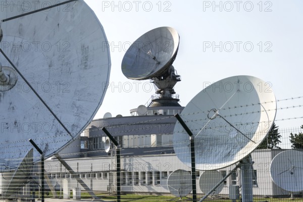 Radar antenna on satellite links center, telecommunication tower, wireless communication concept, clear blue sky on a sunny day Prague, Czech republic