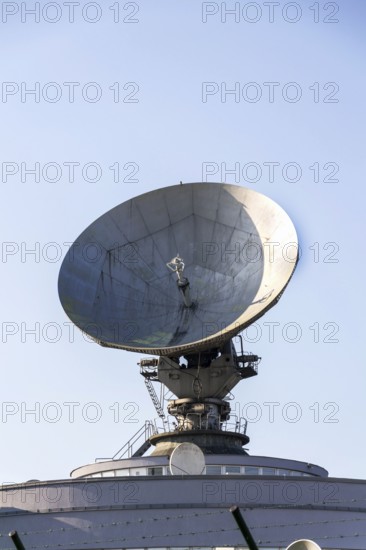 Radar antenna on satellite links center, telecommunication tower, wireless communication concept, clear blue sky on a sunny day Prague, Czech republic