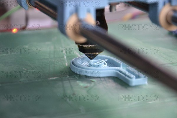 Modular 3d printer prints fully functional blue whistle, green pad