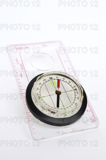 Detail shot of glass compass isolated on white background