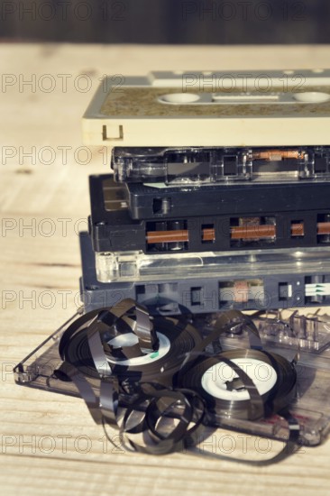 Old broken unwound compact cassette audio tape messed up