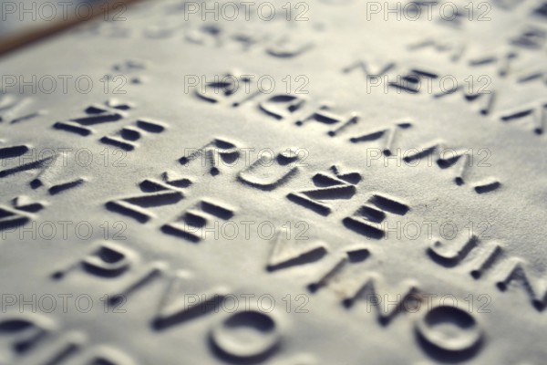 Word rose in Czech language embossed writing letters for blind people used before Braille writing system