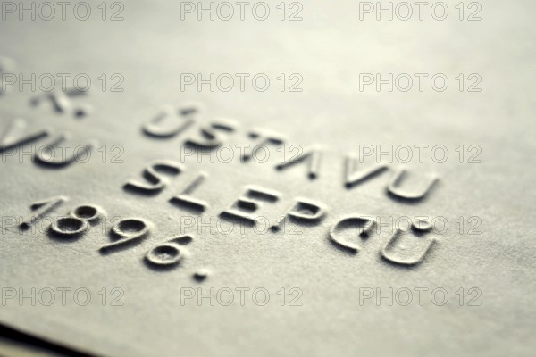 Word blind in Czech language embossed writing letters for blind people used before Braille writing system