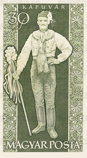 An old vintage Hungarian postage stamp depicting a man in traditional clothing from the town of Kapuvár. Hungary