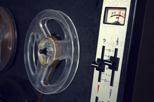 Filtered vintage picture of reel-to-reel audio recorder