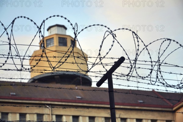 Barbed wire fence layed around prison walls Prague Czech republic