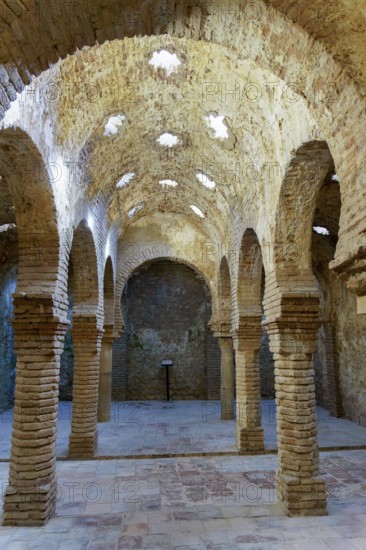 Ronda, malaga, spain Historic arab baths architecture in ronda, spain featuring brick arches and star-shaped skylights, reflecting ancient bathing traditions ronda, malaga, spain