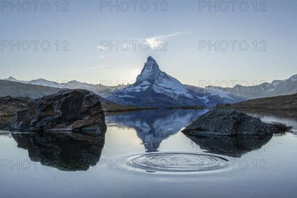 Matterhorn Mountain and Reflection in Lake Stellisee in Evening. Ripples in Circles. Swiss Alps. Valais, Switzerland