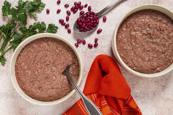Lobio made from red beans, in ceramic dishes, a traditional Georgian dish, homemade