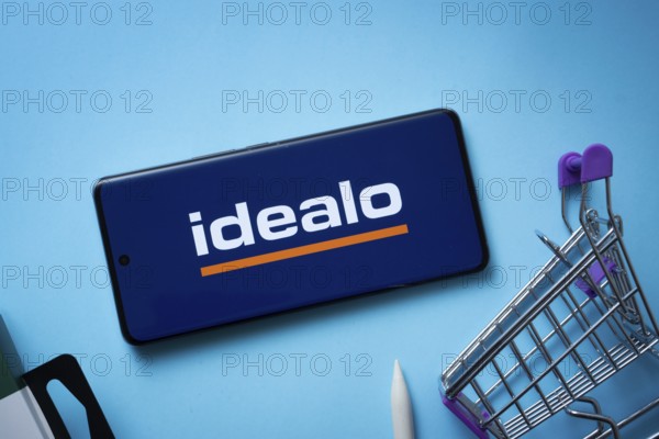 Dhaka, Bangladesh- 03 July 2025: Smartphone displaying idealo logo with shopping cart on a blue background