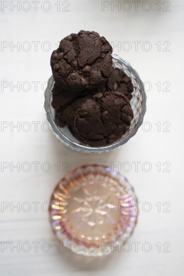 Chocolate chip cookies in a glass cookie jar
