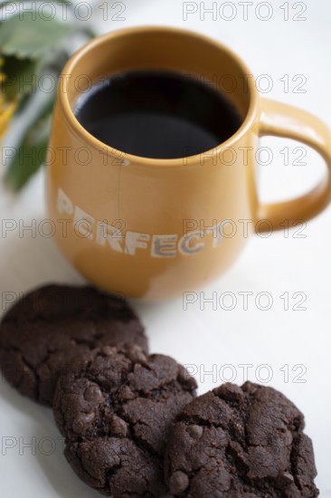 Chocolate chip cookies with a cup of black coffee