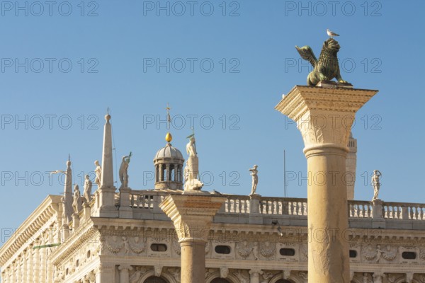 Columns of San Marco and Saint Theodor and detail of library Marchiala on San Marco square, Venice, Italy